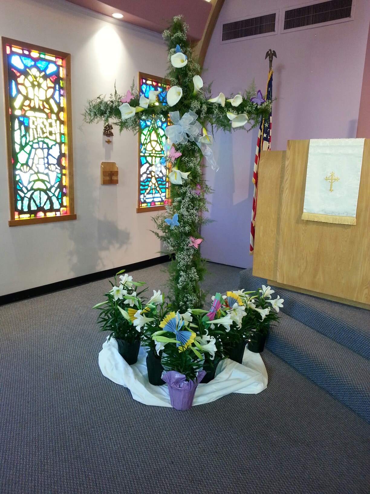 Easter floral cross with lilies and stained glass