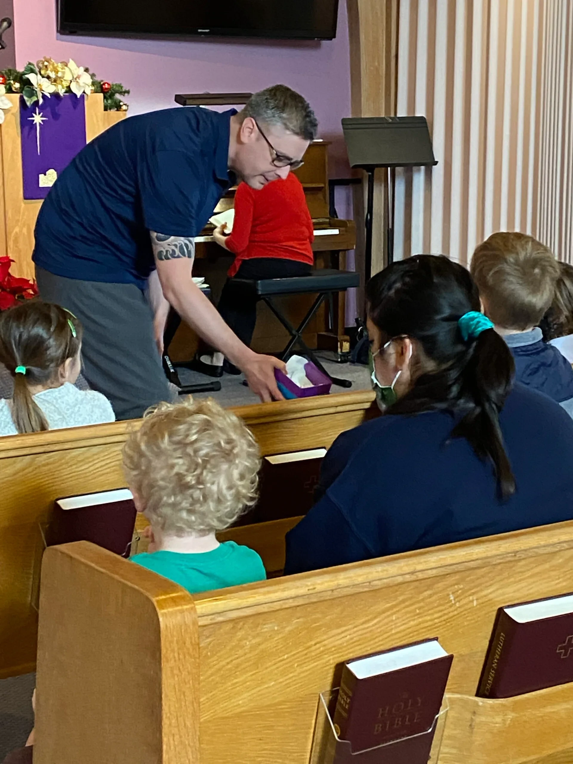 Pastor Scott with children during service