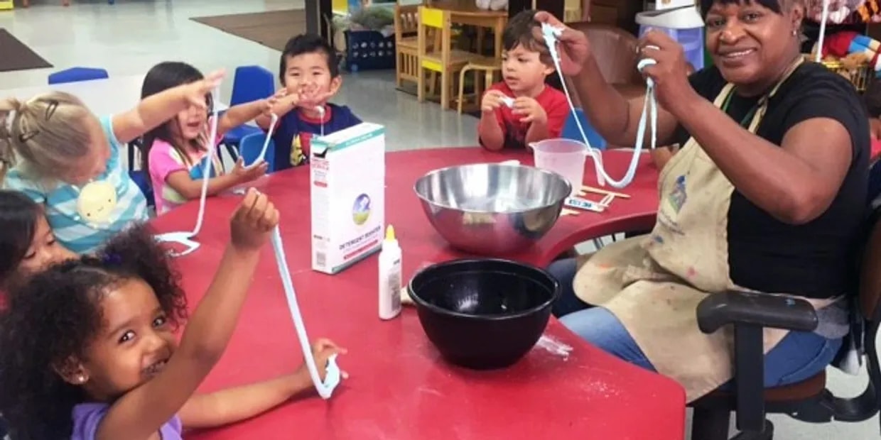 St. John's Preschool children doing a fun activity with a teacher